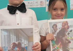 Dzieci pokazują zdjęcia pan nauczycielek z grupy trzeciej i drugiej