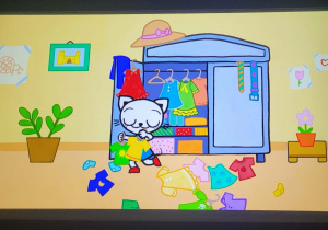 Kicia Kocia przed szafą z ubraniami