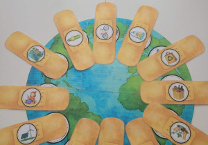 Ziemia z nalepionymi plasterkami dobrych zachowań